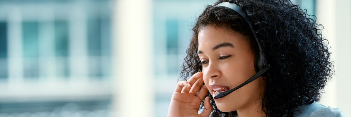 Office worker on headset | iStock-1081576398 - katleho Seisa