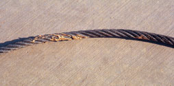 Figure 9. The construction adhesive on this wire rope could interfere with the operation of the hoist brakes.