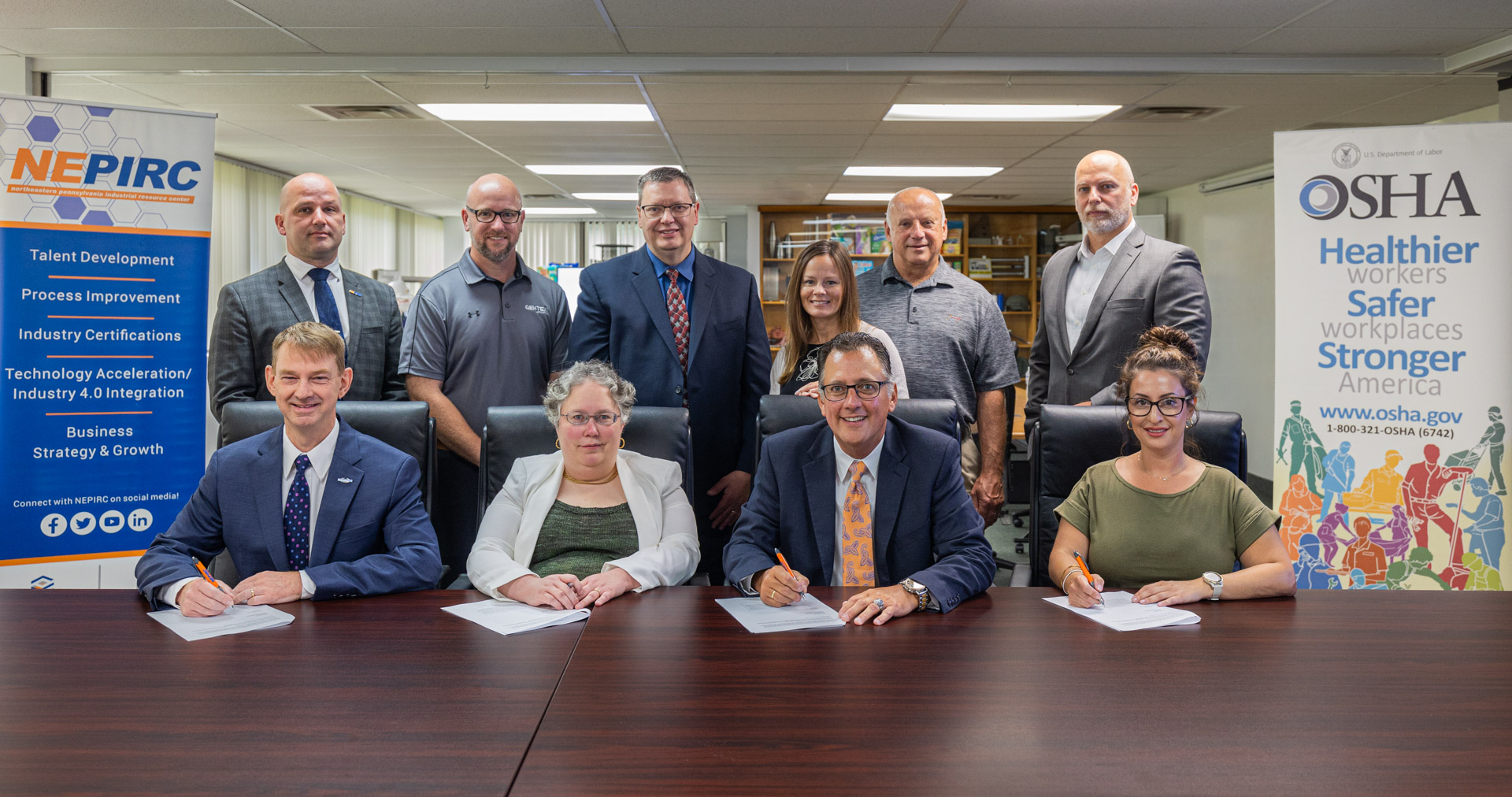 OSHA and NEPIRC representatives, including Wilkes-Barre Area Director Mary Reynolds and NEPIRC President/CEO Eric Esoda (seated, center), at the Alliance signing ceremony on July 14, 2023. 