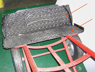 Photo 2 - A hand truck was modified in-house to carry the dies by adding an extension to the frame for the wheels to keep the cart from tipping over, and installing bars on the bottom plate and cart body. A strap was attached at the top of the cart to keep the die from falling off.