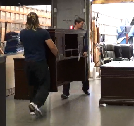 Figure 1 - workers carrying furniture