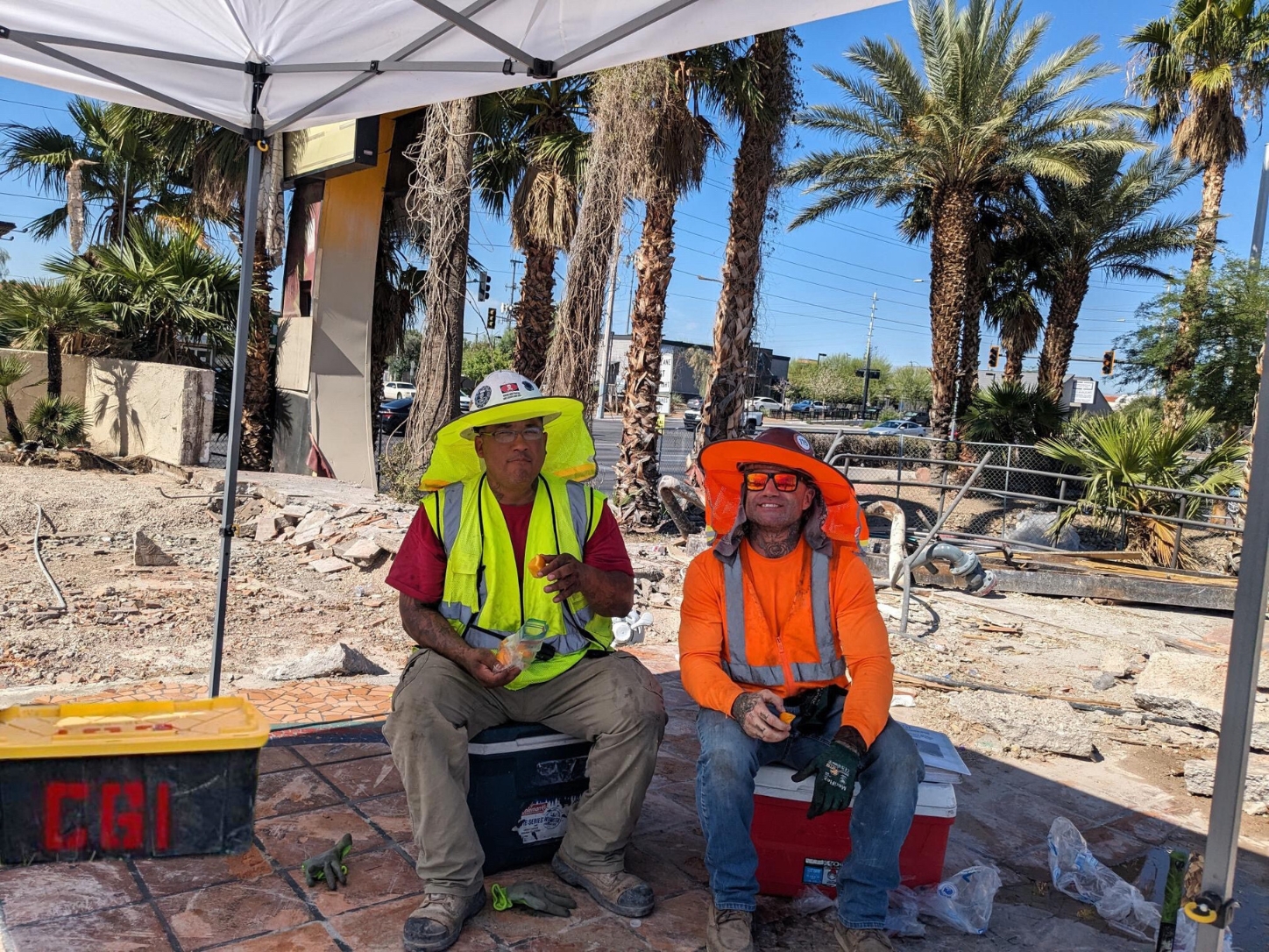 CGI Development of Nevada, LLC : CGI workers are taking a rest break and snacking on cold oranges