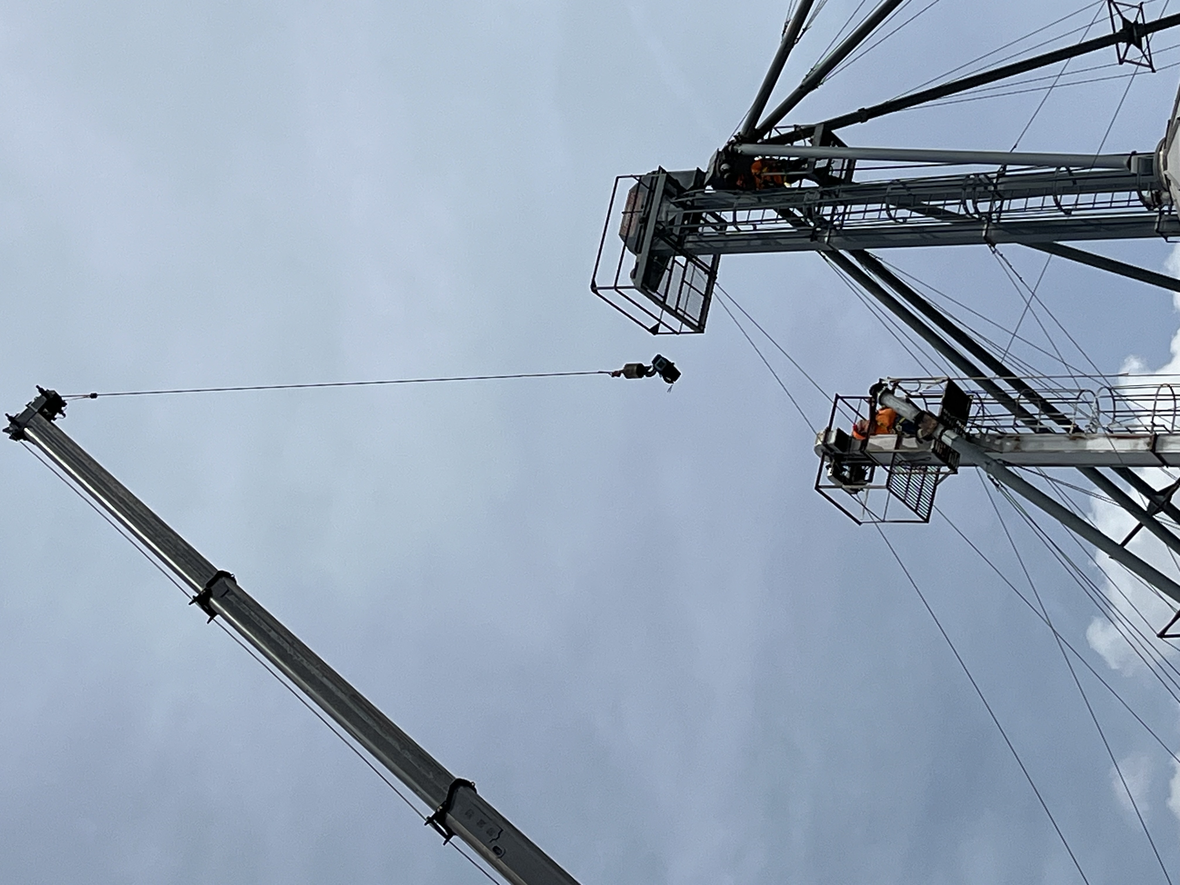 Custom Agri Systems, Inc. : crane operator lifted a cooler with cool water and electrolyte-containing beverages up to them