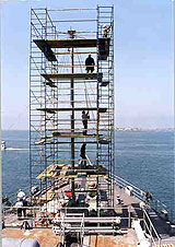 Figure 28: Workers protected from falls while erecting scaffold