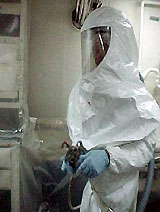 Figure 8: Worker protected from toxic paint fumes with proper PPE