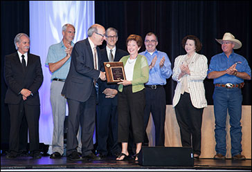 Then-Assistant Secretary of Labor David Michaels, PhD, MPH presenting SGE award to Deb Clingan