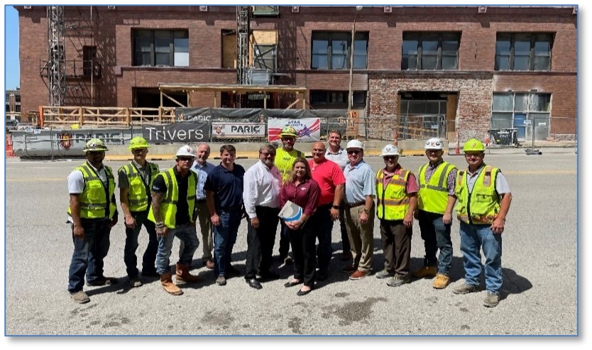 (Sixth from left) OSHA St. Louis Area Director Bill McDonald and Jim Dunard, Chris Malone, Mark Kreikemeier and Shannon Niles of PARIC Corp. signed a partnership to protect construction workers renovating the historic Butler Brothers Building in St. Louis. John Stiffler, from St. Louis Building and Construction Trades Council, and Barry Stelzer from Mid-America Carpenters Regional Council, also signed as union representatives. 