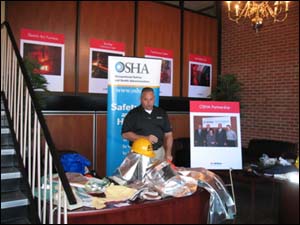 AK Steel's Personal Protection Equipment (PPE) vendor and AK Steels PPE used in the mill. Notice the OSP poster on the right hand side!