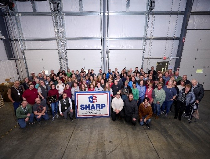 Haltec Corporation Leetonia, Ohio facility employees posing with their SHARP flag