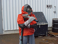 Figure 4: Abrasive blaster with appropriate PPE