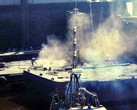 Figure 9: Abrasive blaster on barge creating large dust cloud