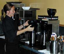 Worker preparing coffee