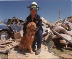 Rescue worker with dog - Copyright: OSHA