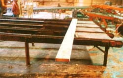 Chain conveyor for moving boards.