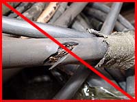 Figure 50: Improper practice - Damaged electrical cable poses shock hazard.