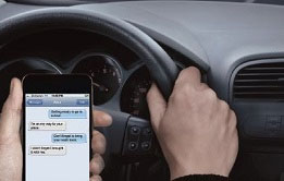 Driver distracted by cell phone. Photo Credit: distraction.gov