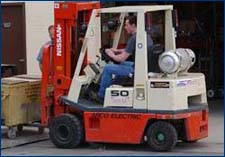 Figure 1 Forklift raises and moves heavy loads.