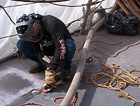 Figure 6: Worker using grinder with deadman control