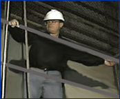 Image of a worker on staging with standard guardrails.