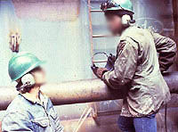 Figure 12: Workers wearing ear muffs for protection from excessive noise.