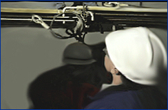 Image of a qualified person inspecting strut connections