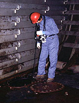 Figure 4: Worker testing space to see that safe conditions are maintained during cleaning