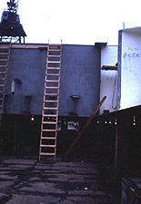 Figure 9: Portable wood ladder at proper angle (4 to 1 ratio) but not extending the required 3 feet above the landing