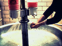 Figure 11: Worker using washing facilities.