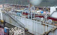 Figure 5: Worker on gangway between edge of floating dry dock and vessel