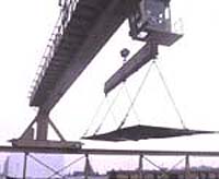 Figure 1: Metal plate lifted using shackles for rigging connections