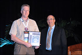 Then-Assistant Secretary of Labor Dr. Michaels, PhD, MPH., presenting SGE award to Raymond Magruder