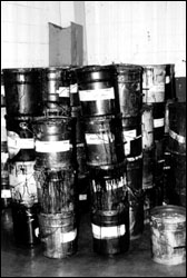 Figure 26. Press return ink is stored in 5 gallon pails. The hazard of lifting heavy pails is increased by high or low lifting heights and poor access.