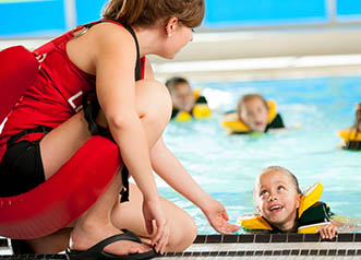 Life Guarding - a pool with kids learning to swim | copyright:FatCamera - iStock.com - 174942851