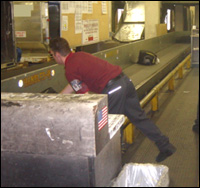 Figure 1. Bending over to get baggage