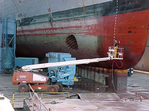 Image of a worker using an aerial lift