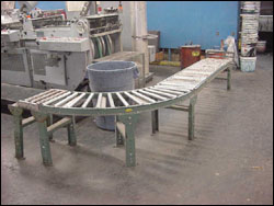 Figure 33. Use a conveyor system to minimize carrying packages.