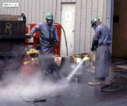 Figure 5: Workers using high-pressure water to clean