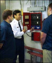 Figure 3. Inspection of fire protection system alarms (shore-based) by fire department personnel.