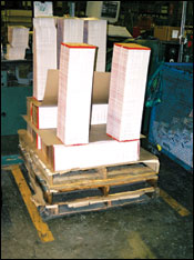 Figure 18. Notice multiple pallets to elevate signatures, but height of signature piles may be too high for some individuals.