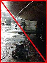 Figure 13: Improper practice - Wet and oily surfaces create slipping hazard