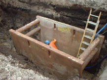 A trench box is being used-but what is wrong with this picture? Hint-what would happen if the soil on top collapsed?