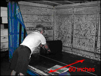 Figure 10. Reaching to the back of a cart can cause back and shoulder strain.