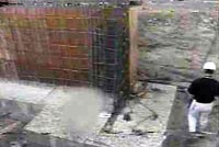 Worker passing by rebar column of accident site