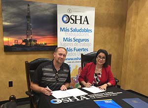 Elizabeth Linda Routh, OSHA area director, Lubbock Area Office and John R. Fehr, president of the Fehr's Metal Building Construction, LLC sign a two-year alliance renewal agreement at the Fehr's facility in Seminole, Texas Source: OSHA Region 6