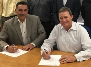 OSHA Area Director Travis Clark (left) and McCarthy Building Companies President Jim Stevenson recently signed an alliance to help protect employees involved in construction at Christus Spohn Hospital in Corpus Christi.