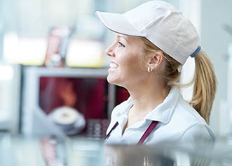 Restaurants - young worker at fastfood counter | copyright:zokara - iStock.com:174938531