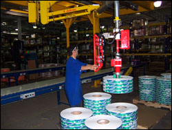 Figure 35. Use a lift to place finished rolls onto and remove supply rolls from a pallet.