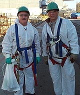 Figure 1: Workers equipped with full body harnesses, lanyards and oversized snaphooks.