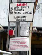 Figure 11: SCP report and other warning signs at gangway entrance to vessel.