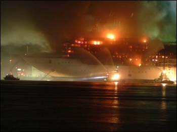 Figure 1. Vessel on fire being extinguished by fireboats.